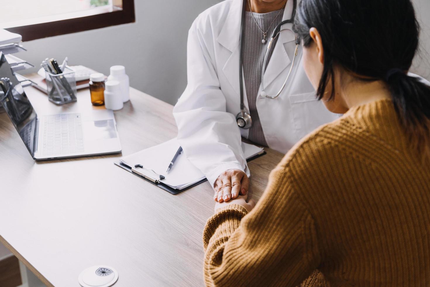 Homecare nursing service and elderly people cardiology healthcare. Close up of young hispanic female doctor nurse check mature caucasian man patient heartbeat using stethoscope during visit photo