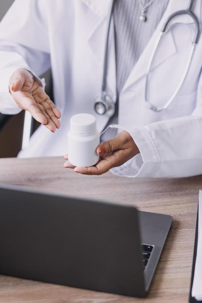 Homecare nursing service and elderly people cardiology healthcare. Close up of young hispanic female doctor nurse check mature caucasian man patient heartbeat using stethoscope during visit photo