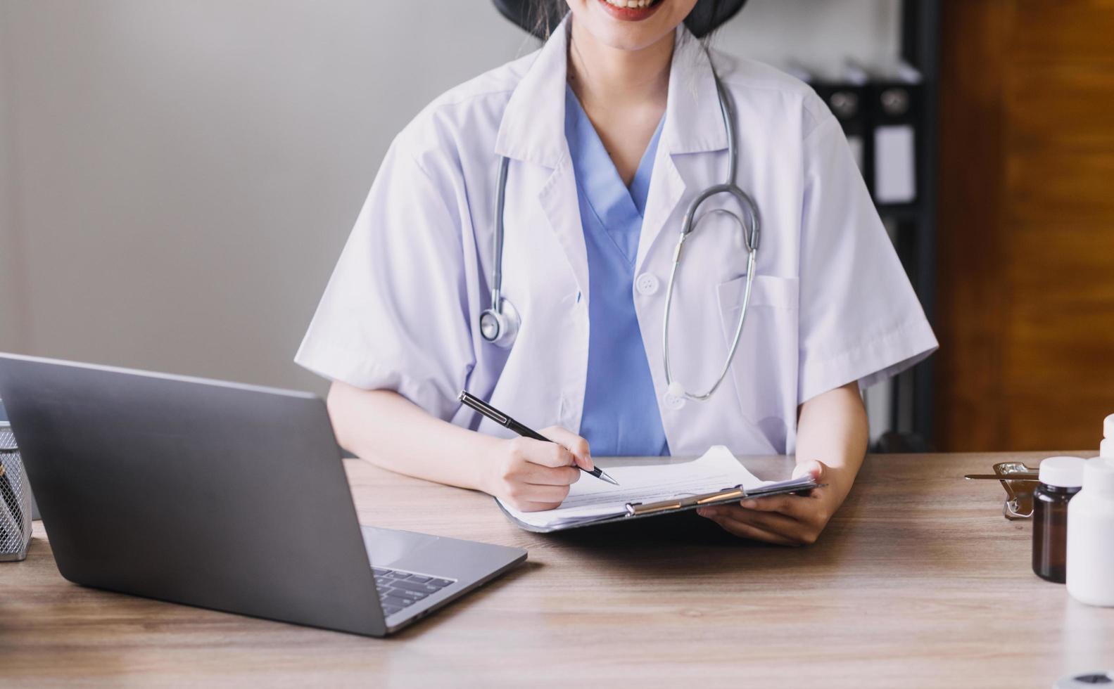 Homecare nursing service and elderly people cardiology healthcare. Close up of young hispanic female doctor nurse check mature caucasian man patient heartbeat using stethoscope during visit photo