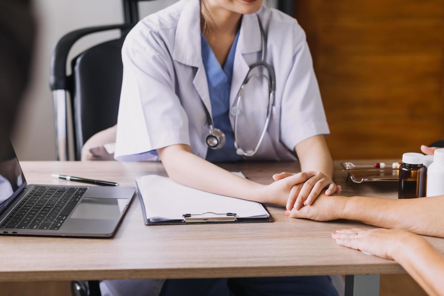 Homecare nursing service and elderly people cardiology healthcare. Close up of young hispanic female doctor nurse check mature caucasian man patient heartbeat using stethoscope during visit photo