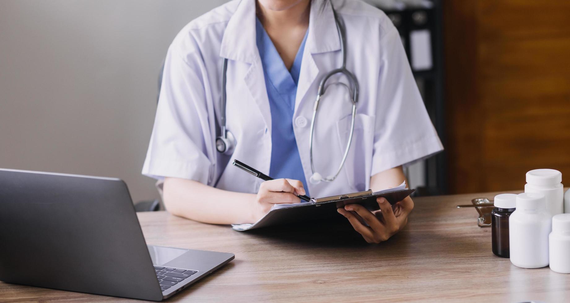 Homecare nursing service and elderly people cardiology healthcare. Close up of young hispanic female doctor nurse check mature caucasian man patient heartbeat using stethoscope during visit photo