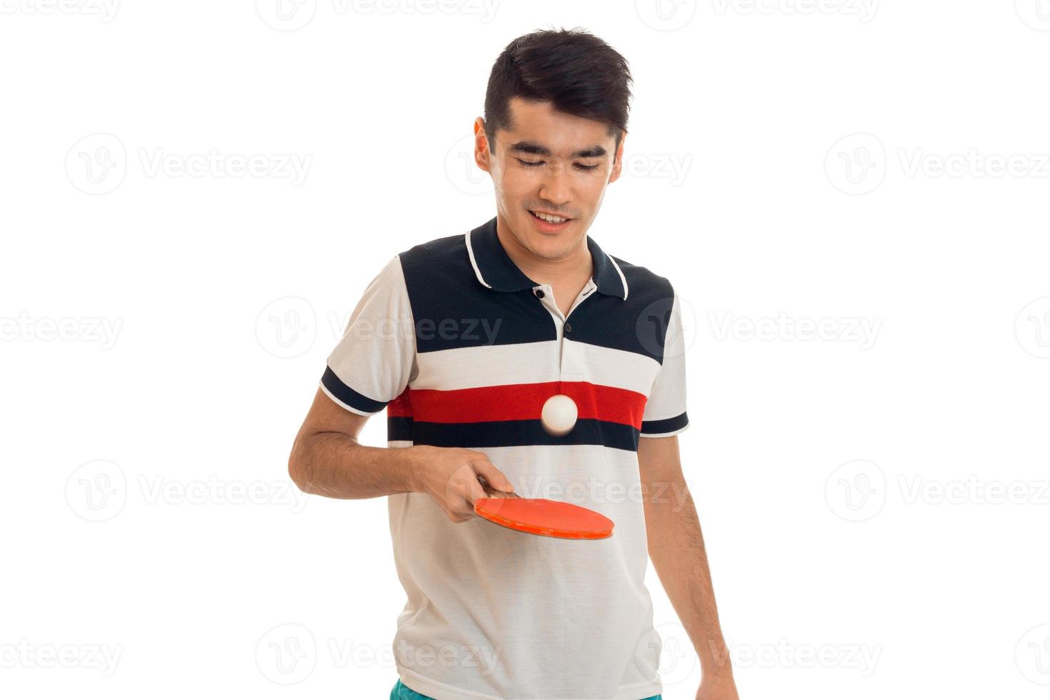 cheerful brunett sportsman practicing ping-pong isolated on white photo