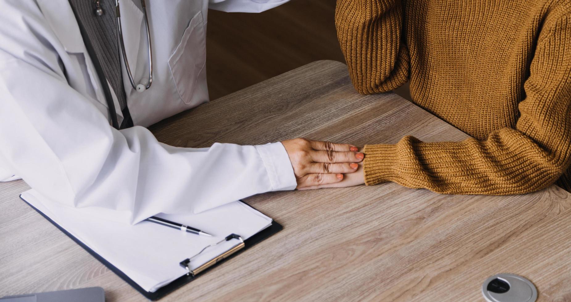 Homecare nursing service and elderly people cardiology healthcare. Close up of young hispanic female doctor nurse check mature caucasian man patient heartbeat using stethoscope during visit photo