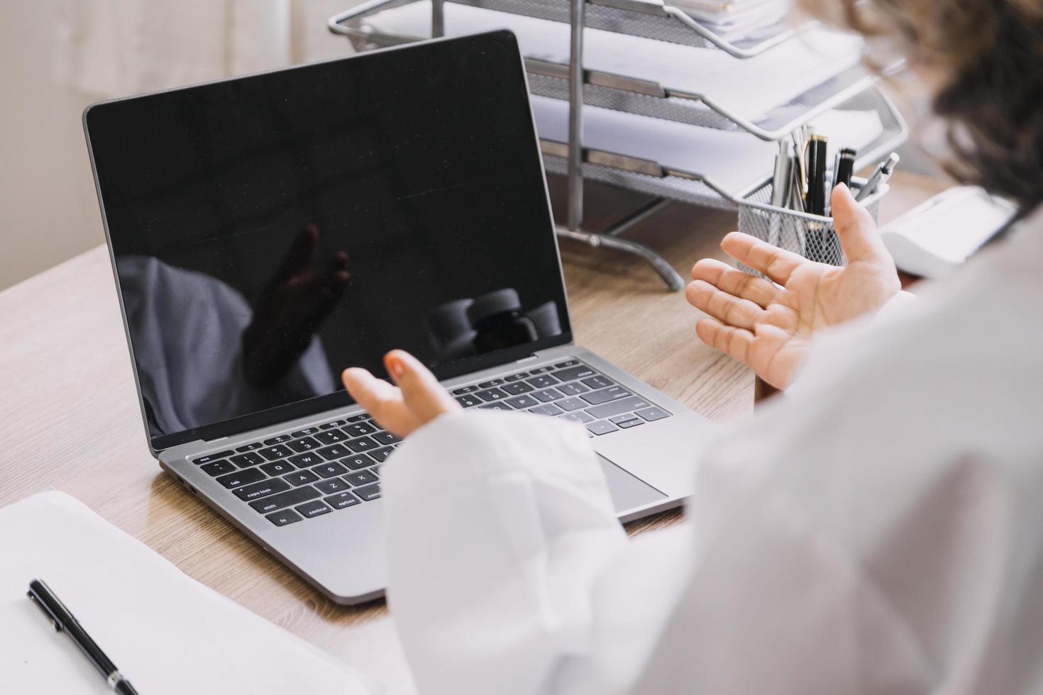 Homecare nursing service and elderly people cardiology healthcare. Close up of young hispanic female doctor nurse check mature caucasian man patient heartbeat using stethoscope during visit photo