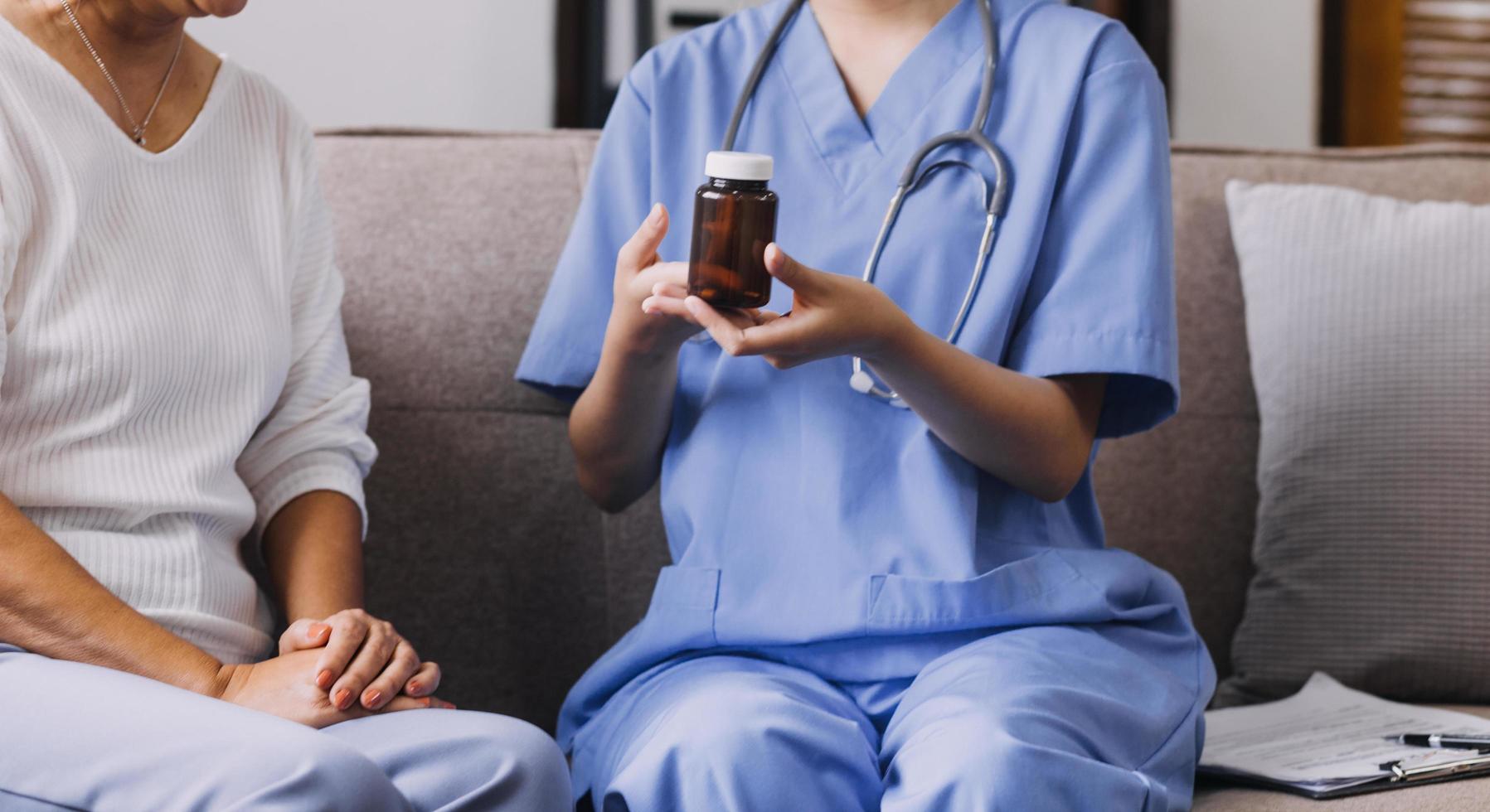 Homecare nursing service and elderly people cardiology healthcare. Close up of young hispanic female doctor nurse check mature caucasian man patient heartbeat using stethoscope during visit photo