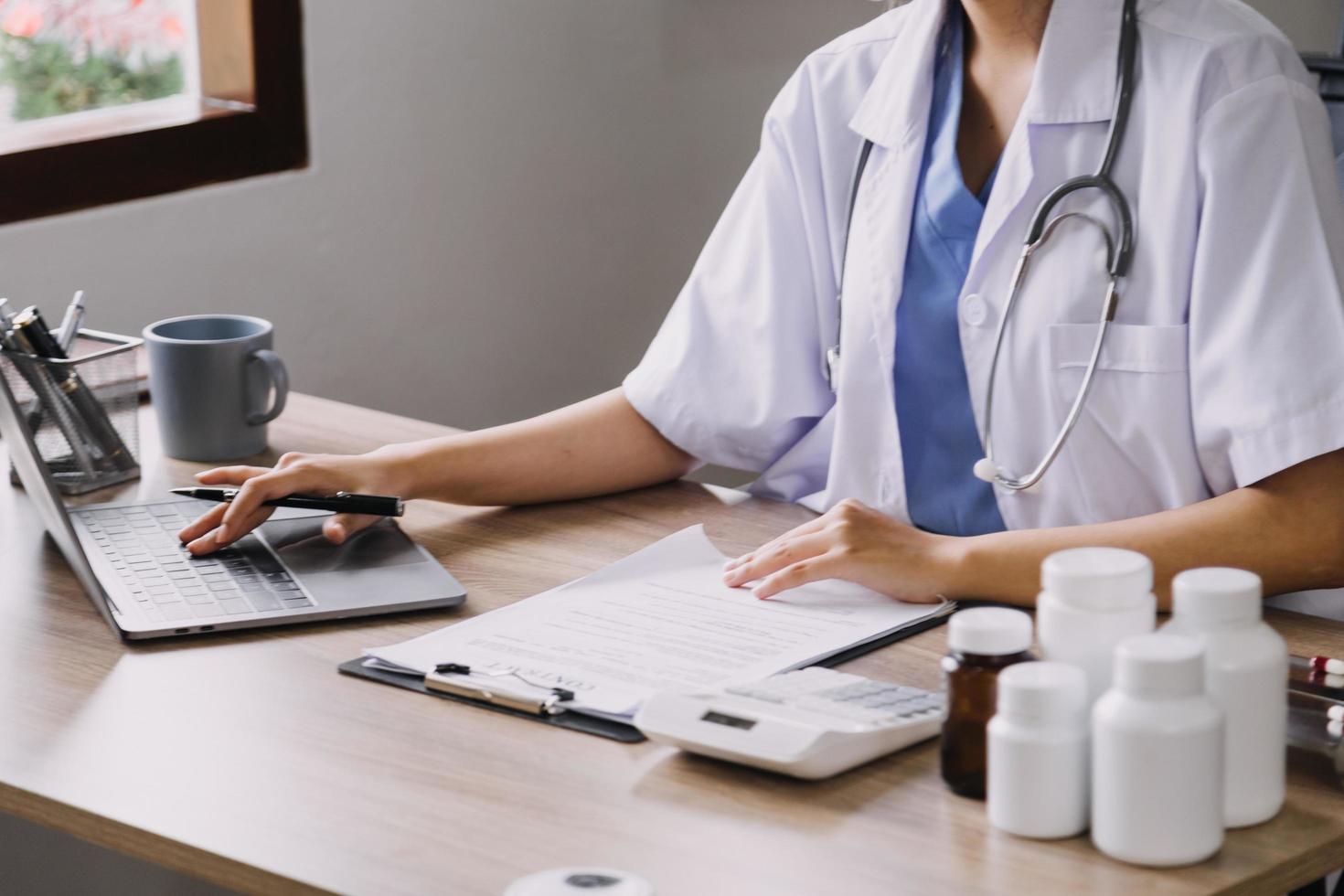 Homecare nursing service and elderly people cardiology healthcare. Close up of young hispanic female doctor nurse check mature caucasian man patient heartbeat using stethoscope during visit photo