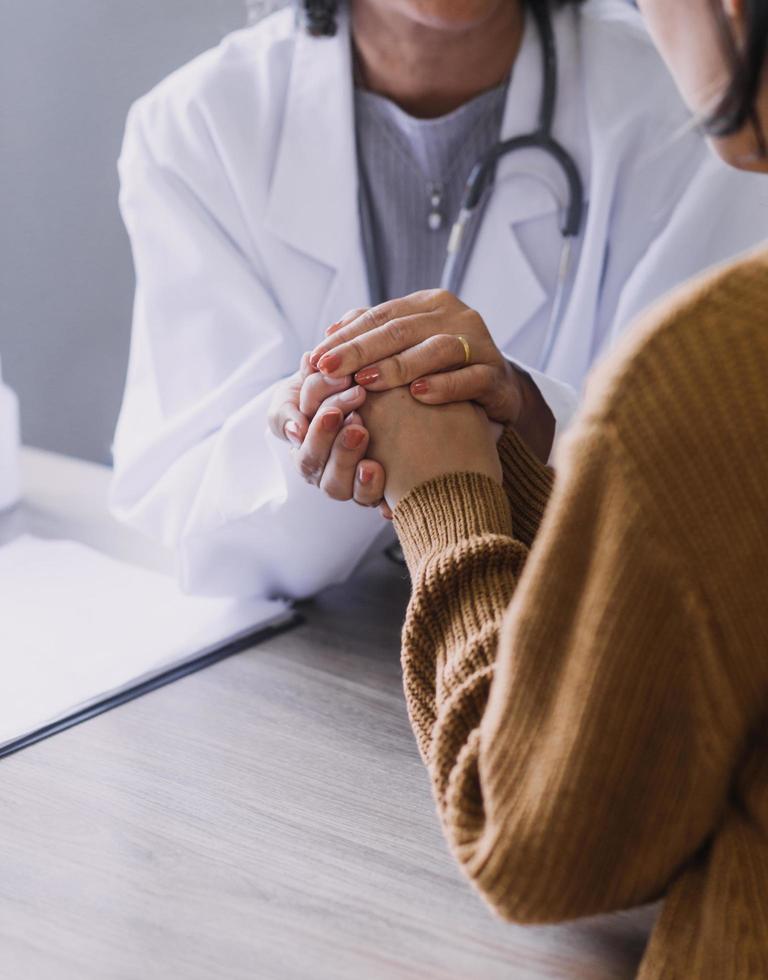 Homecare nursing service and elderly people cardiology healthcare. Close up of young hispanic female doctor nurse check mature caucasian man patient heartbeat using stethoscope during visit photo