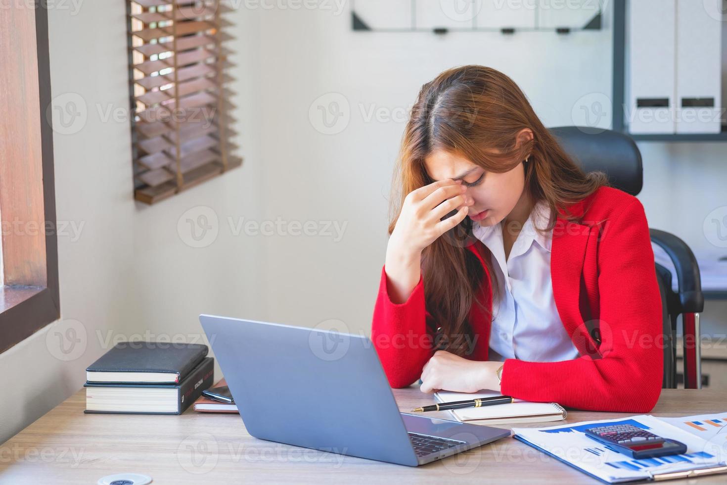 Concept Burnout Syndrome. Business Woman feels uncomfortable working. Which is caused by stress, accumulated from unsuccessful work And less resting body. Consult a specialist psychiatrist. photo