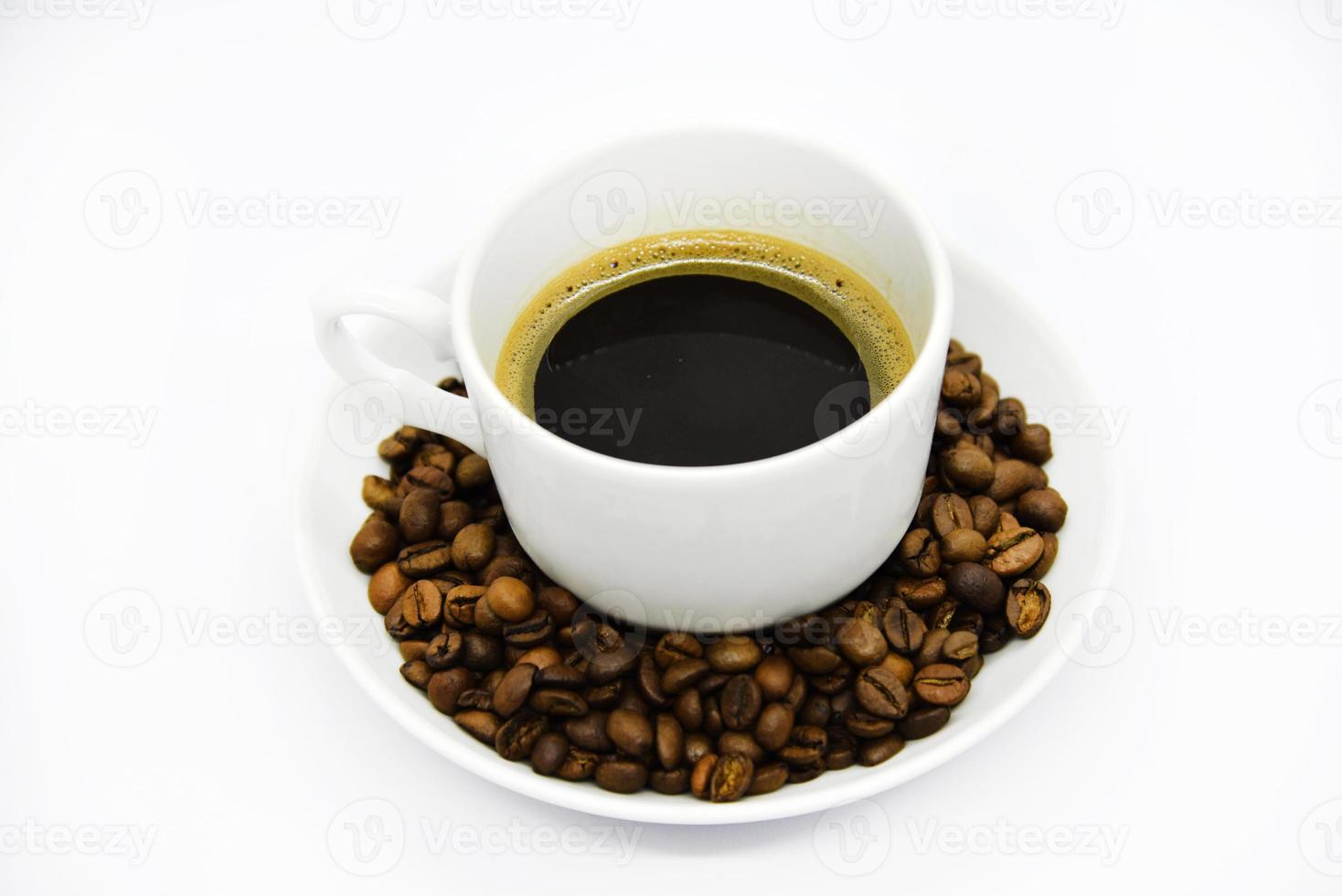 Porcelain coffee cup on a white background. Delicious coffee in a cup and coffee beans. photo