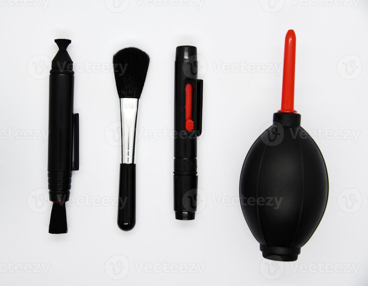 Tools for cleaning photo optics. Pneumatic pear brush on a white background. Camera cleaning kit.