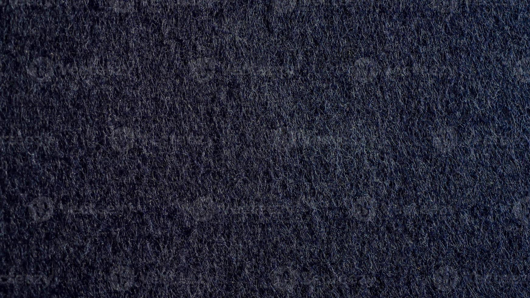 Close-up Texture of Dark blue velvet paper , dark blue suede or navy blue fabric, nubuck textile, background wallpaper photo