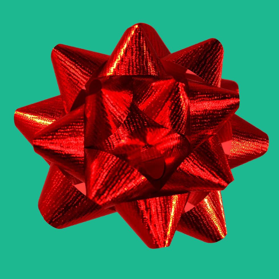 Red Christmas Bow with Green Background photo