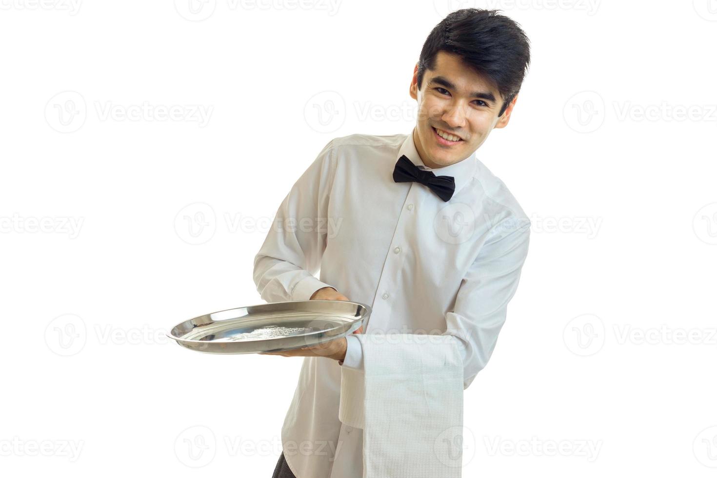 hilarious amazing waiter smiling and holding a tray with a towel photo