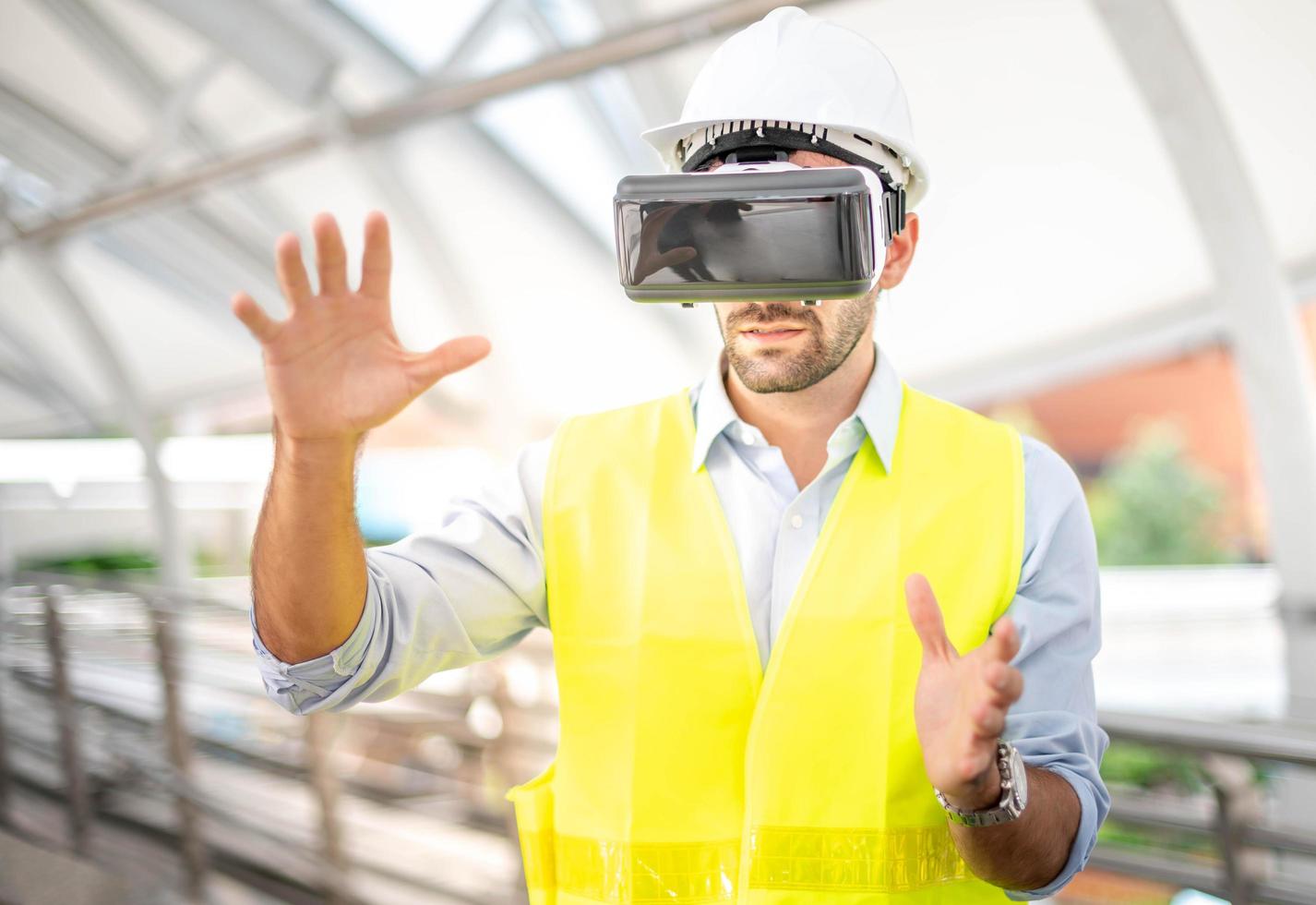 Caucasian man use VR glasses watching video for entertainment, work, free time and study. Virtual reality technology concept. photo