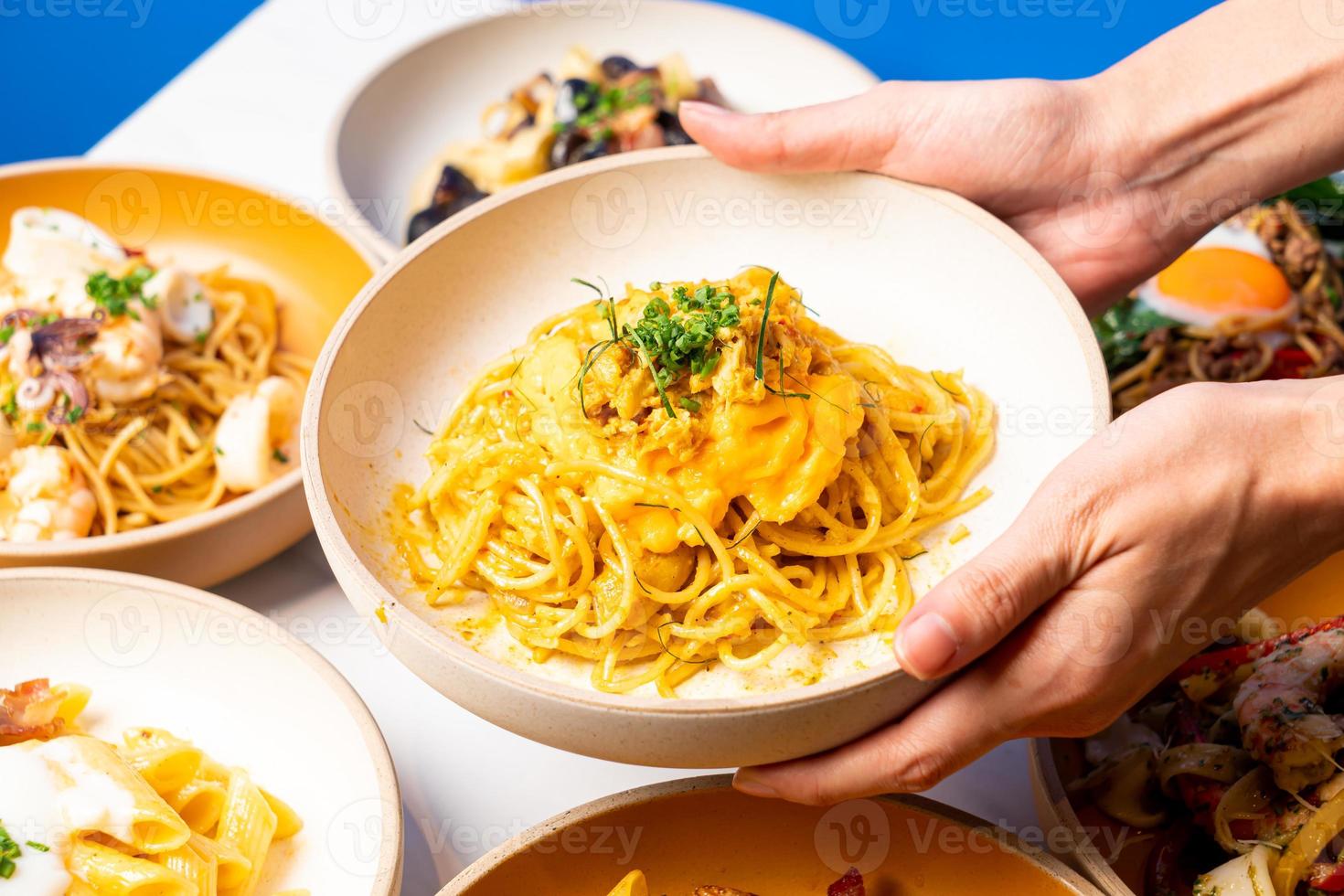 spaghetti with spicy crab curry in Thai style photo