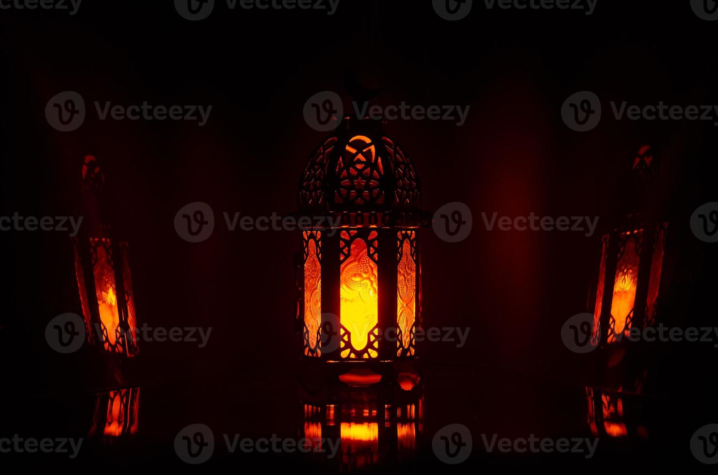 Lantern with reflection from background for the Muslim feast of the holy month of Ramadan Kareem. photo