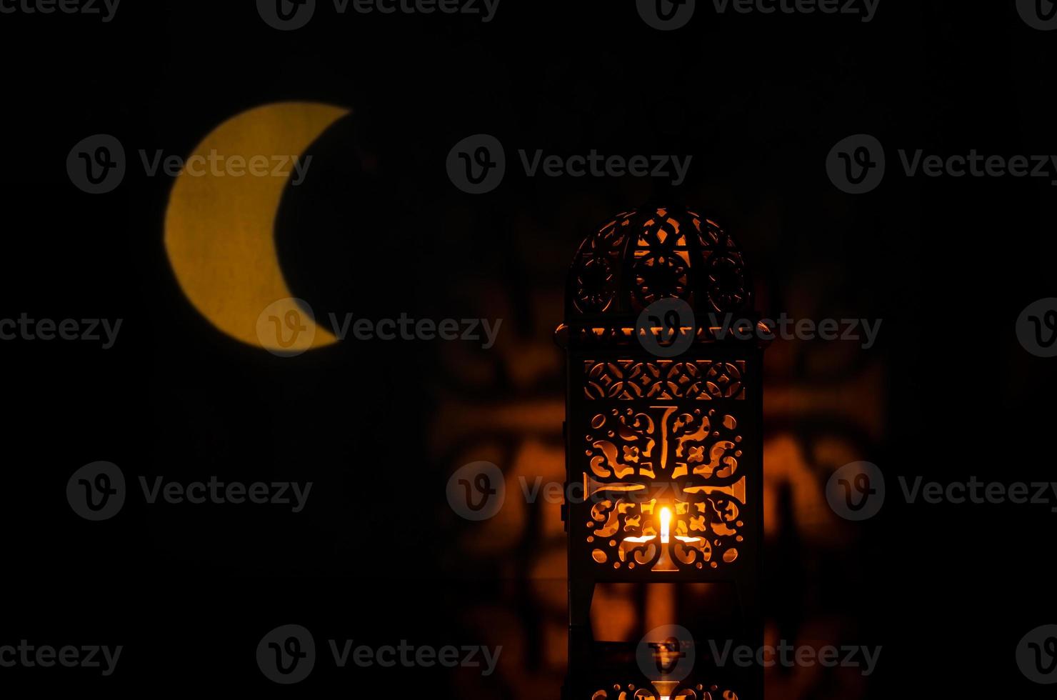 Lantern with moon shape from light on background for the Muslim feast of the holy month of Ramadan Kareem. photo