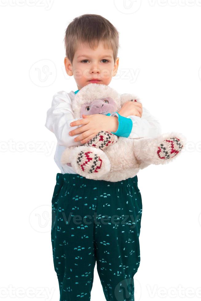 Little boy with a plush toy photo