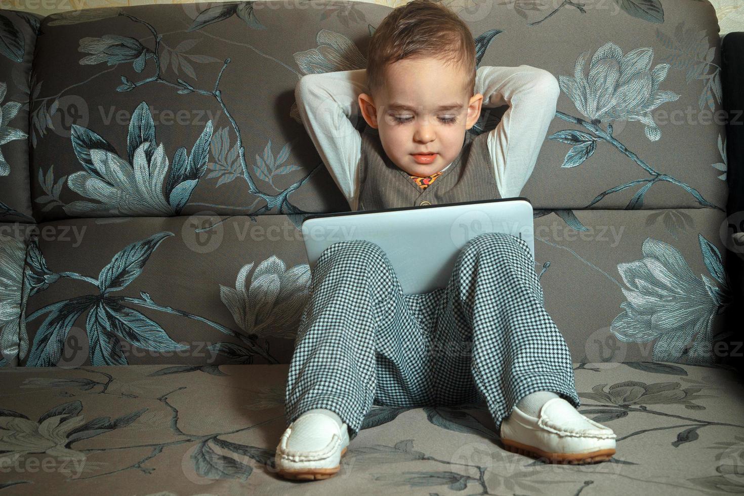 elegant boy with tablet photo