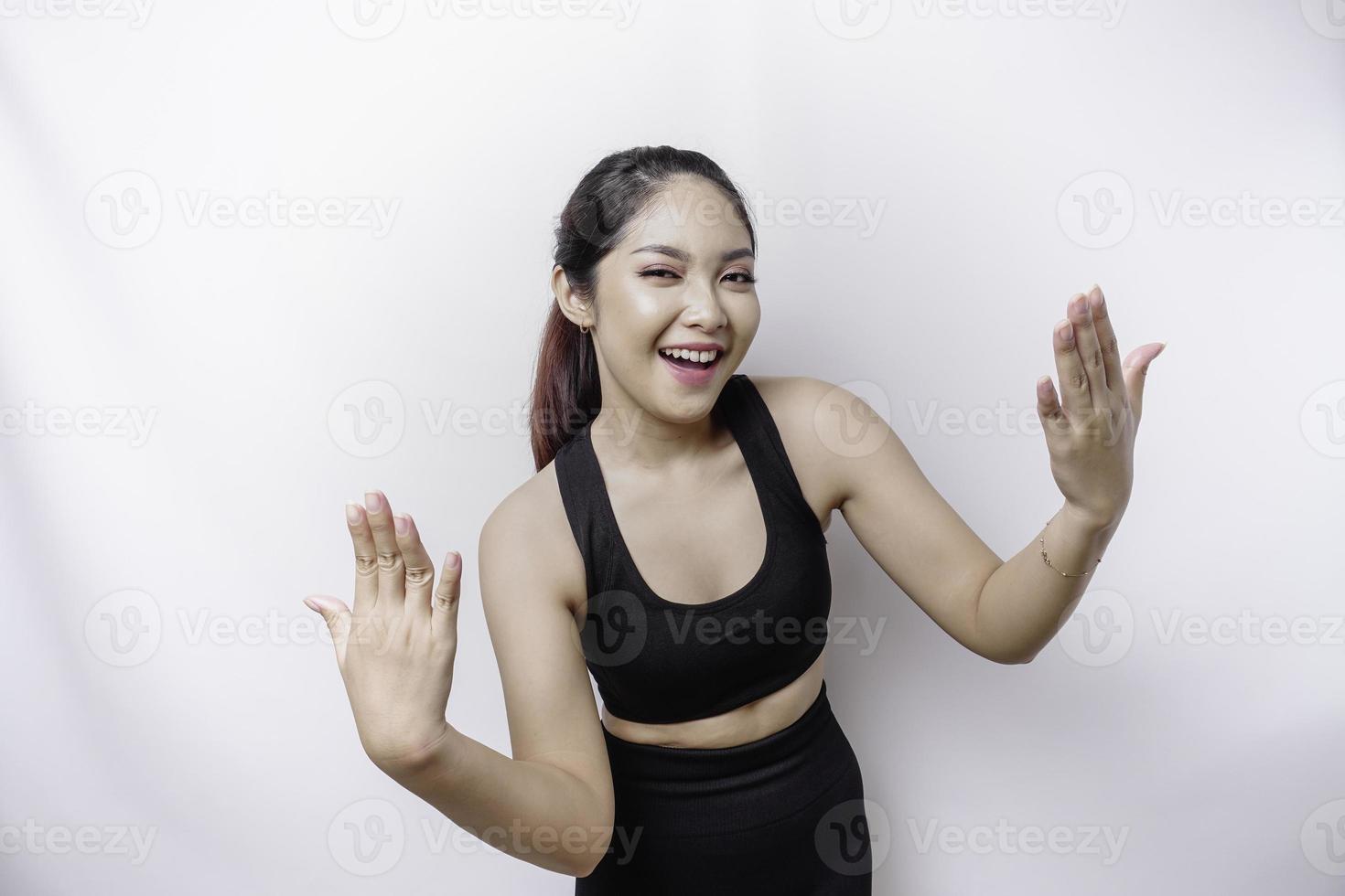 Young Asian beautiful sporty woman over isolated white background inviting to join with hand. Happy that you came photo