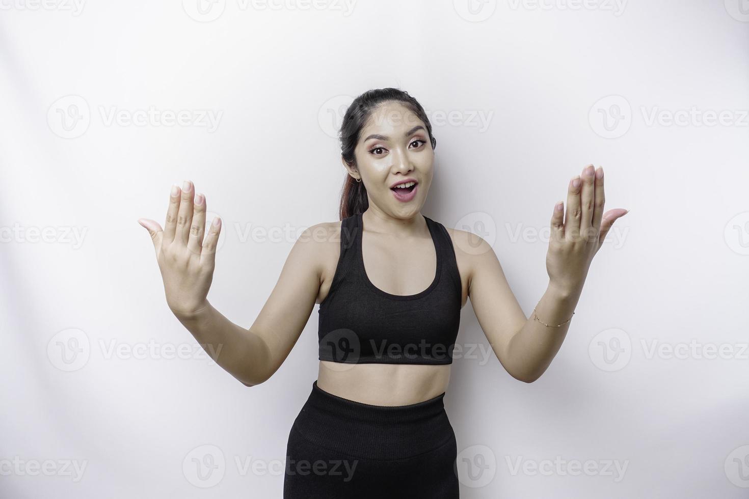 Young Asian beautiful sporty woman over isolated white background inviting to join with hand. Happy that you came photo