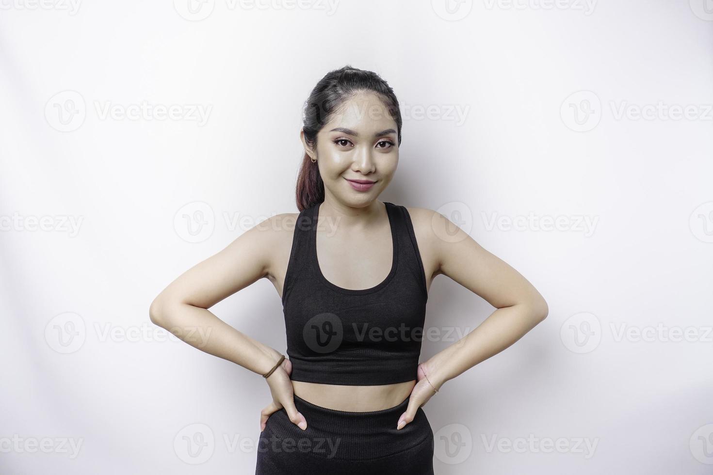 Shot of a sporty young confident woman posing against a white background. photo
