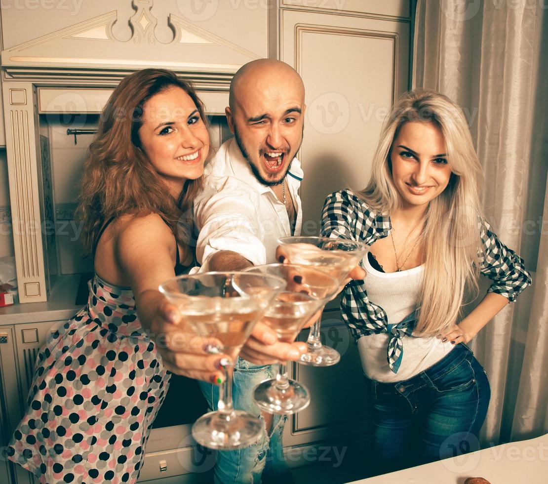 joyful people at a party with a martini photo