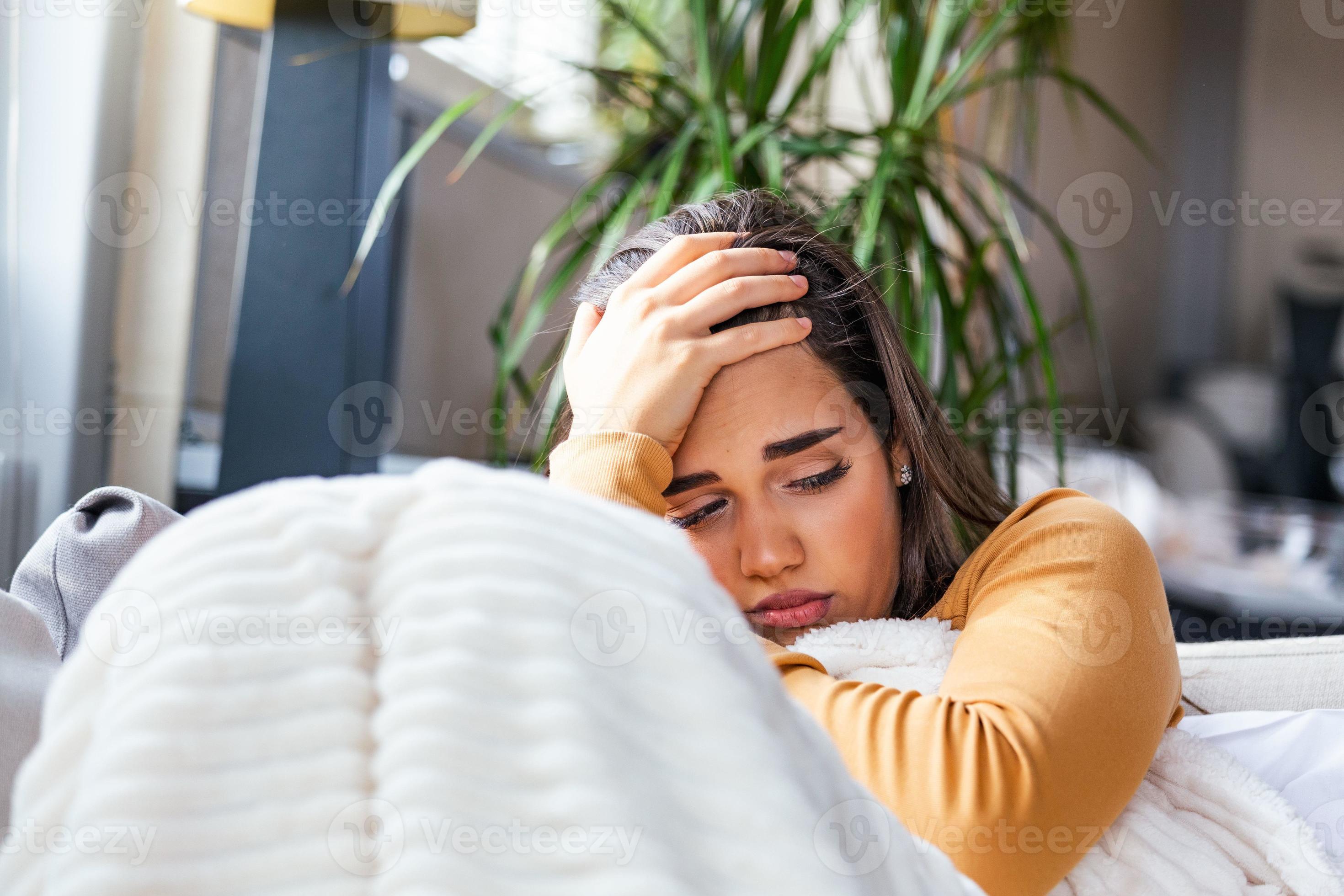 Sick Woman With Headache Sitting Under The Blanket Sick Woman With sick-woman-with-headache-sitting-under-the-blanket-sick-woman-with