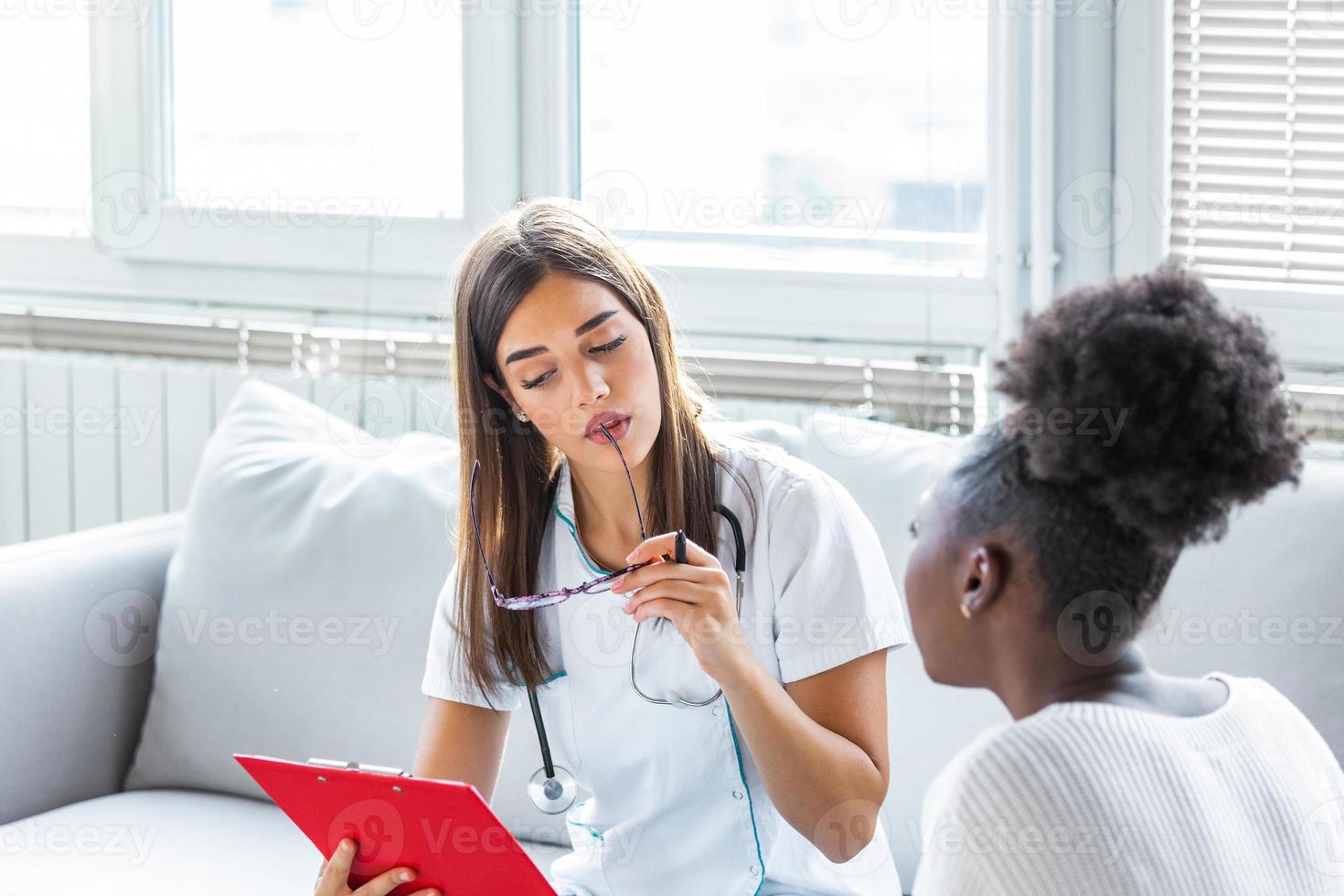 Female doctor meeting with a patient in the office, she is giving a prescription to the woman, healthcare and medicine concept photo