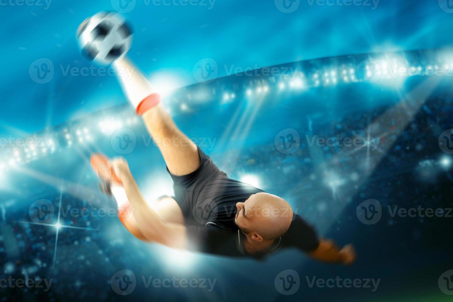 Soccer player in action shoots the ball reverse photo