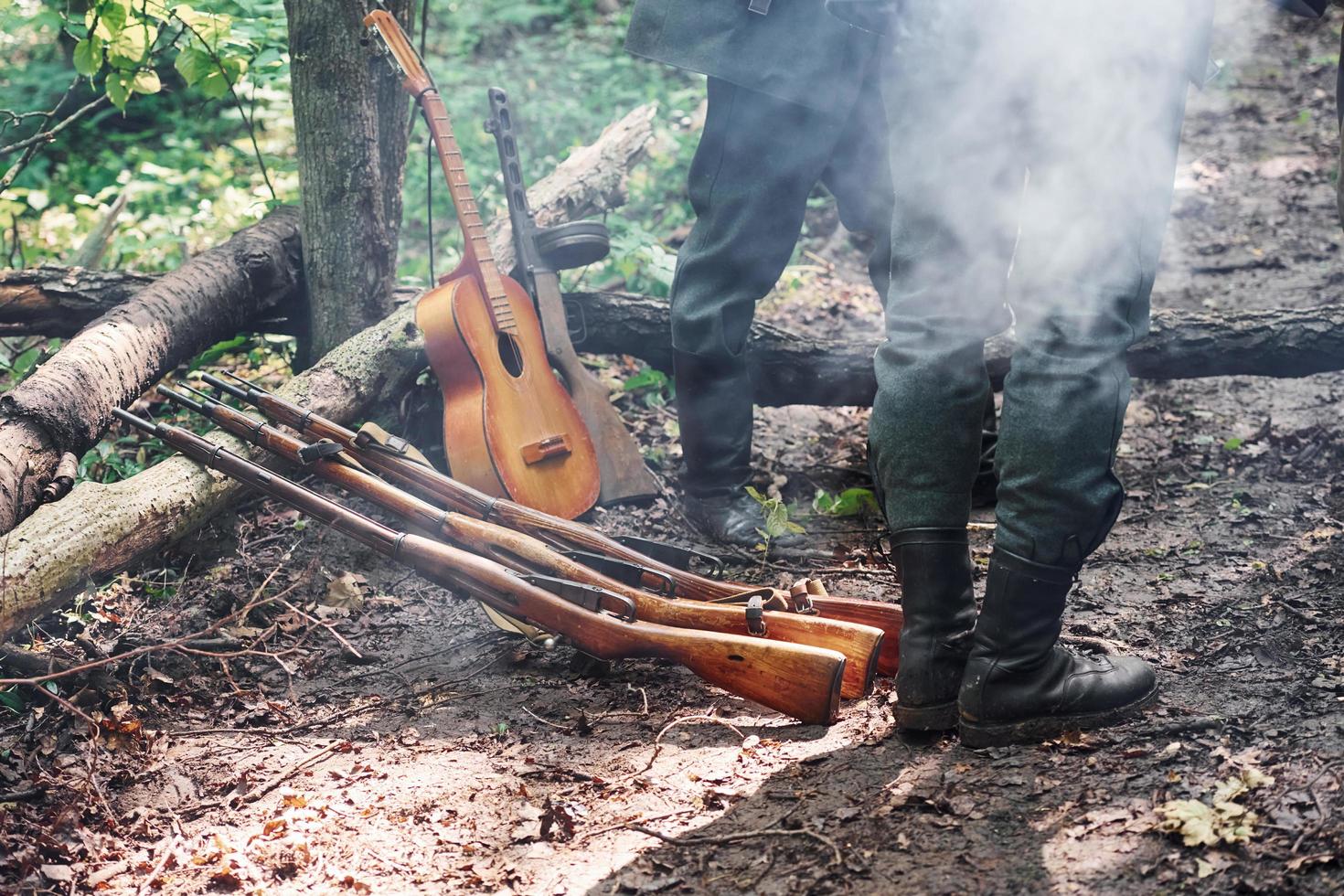 TERNOPIL, UKRAINE - June 2020 UPA Ukrainian Insurgent Army movie filming. Pictures of backstage. Weapons and acoustic guitar photo