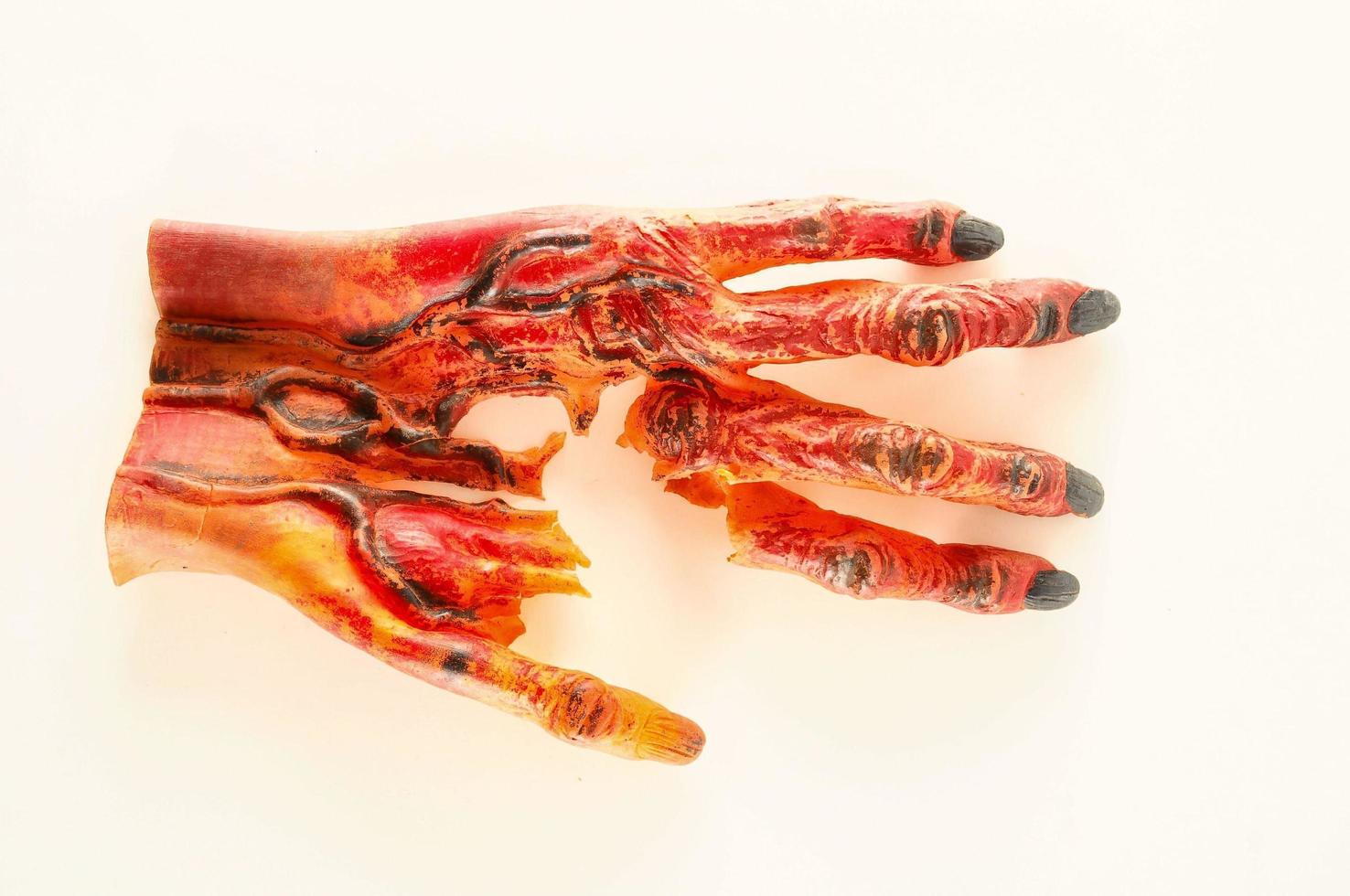 Plastic zombie hand costume photo