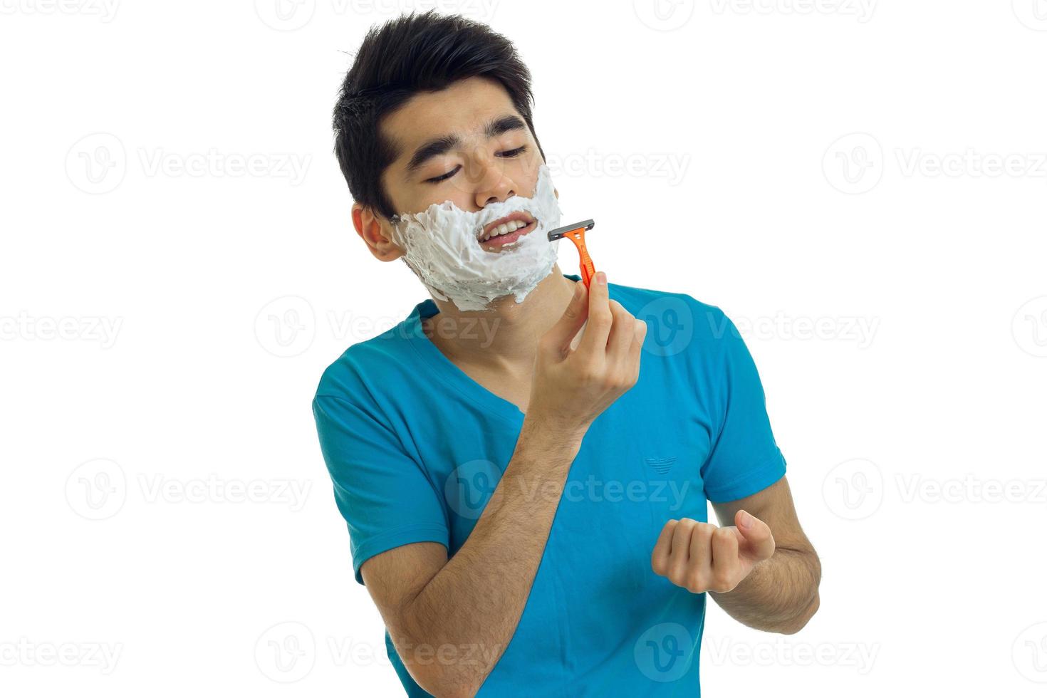 young Brunettes with facial foam shaves using a grinder photo