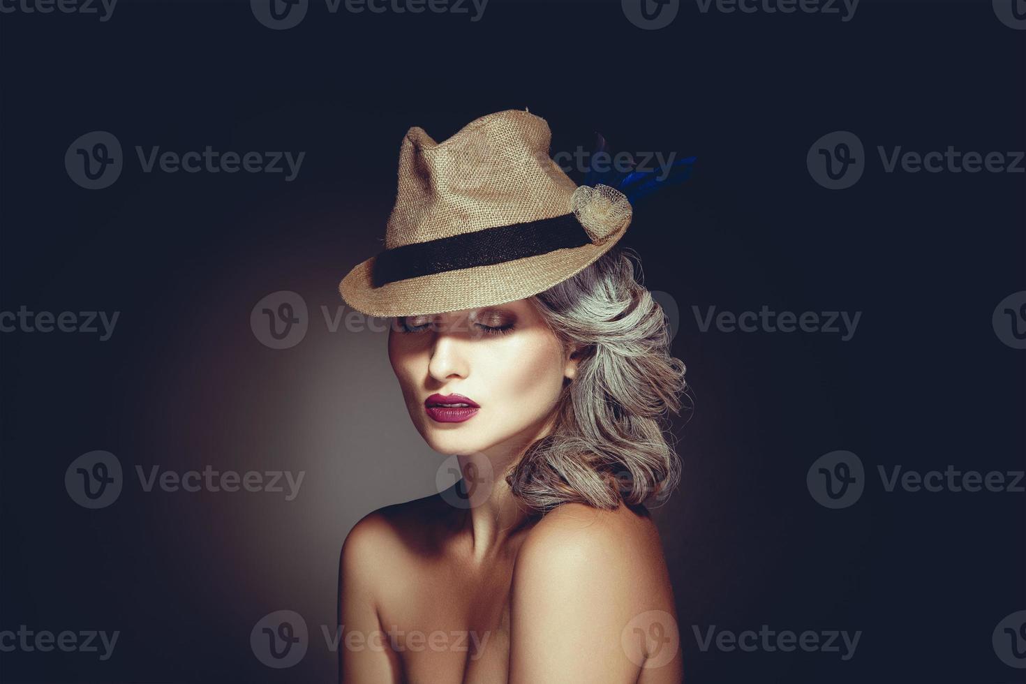 Photo of charming woman with grey hair color and beautiful makeup in hat