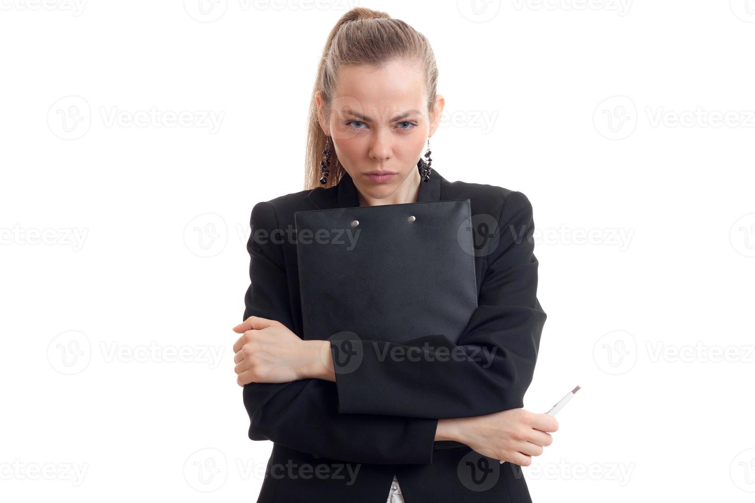 young sexy business woman in black jacket looks at the camera and holding a Tablet photo