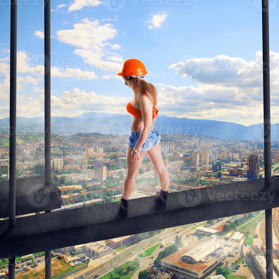 woman builder in a helmet photo