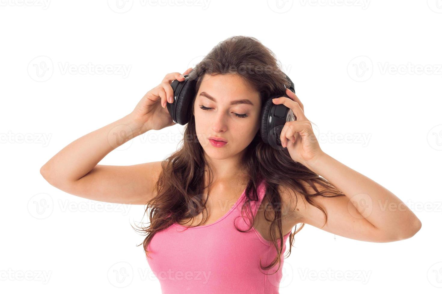 girl in headphones in studio photo