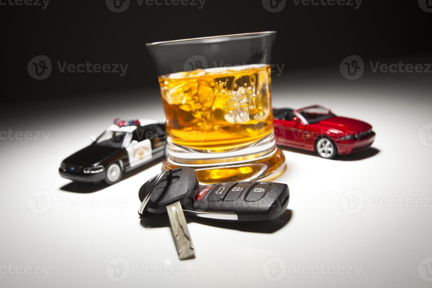 Highway Patrol Police and Sports Car Next to Alcoholic Drink and Keys photo