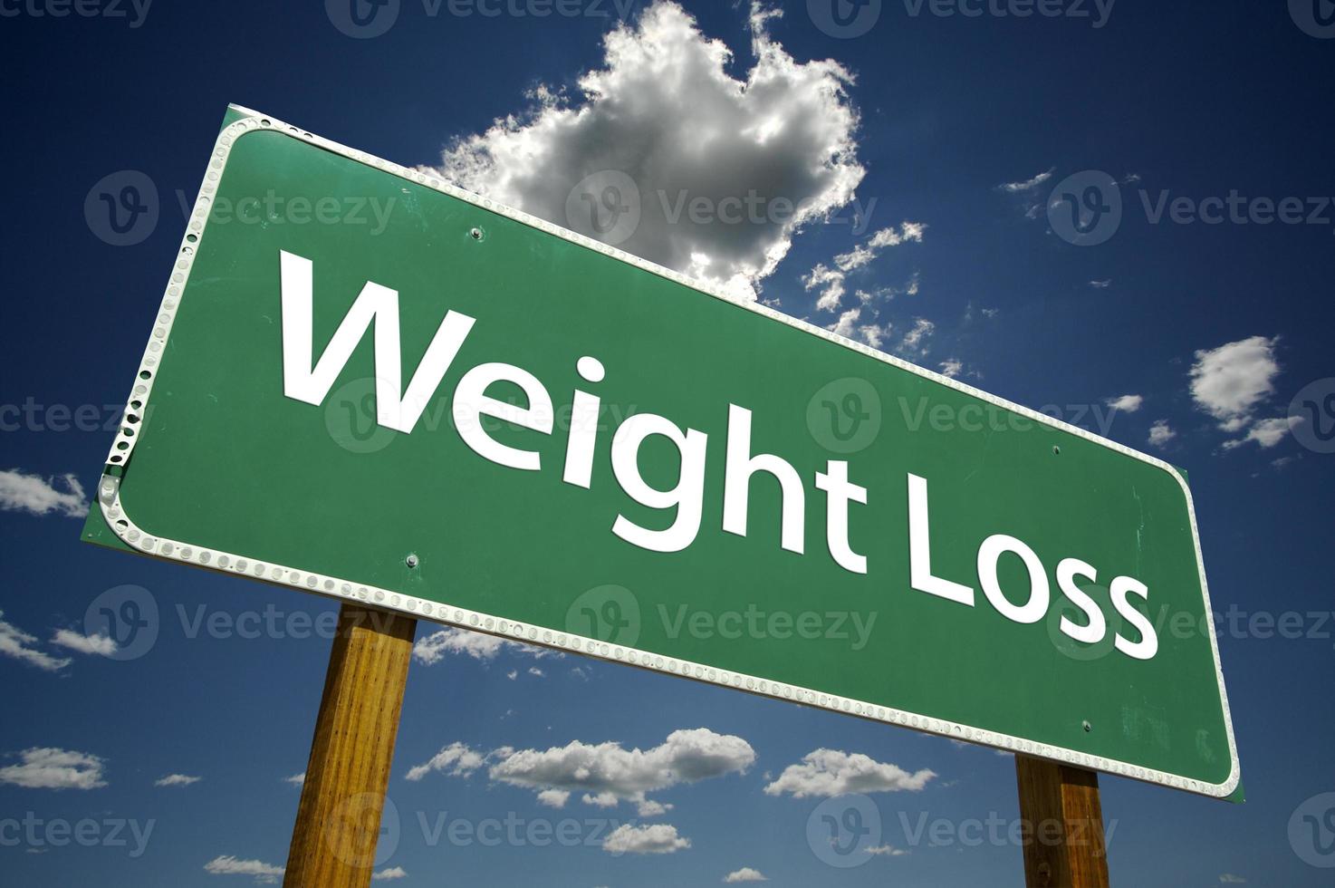 Weight Loss Green Road Sign on Clouds photo