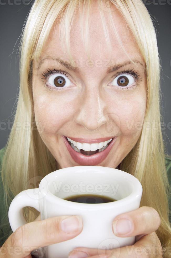 Beautiful Woman Enjoys Coffee photo