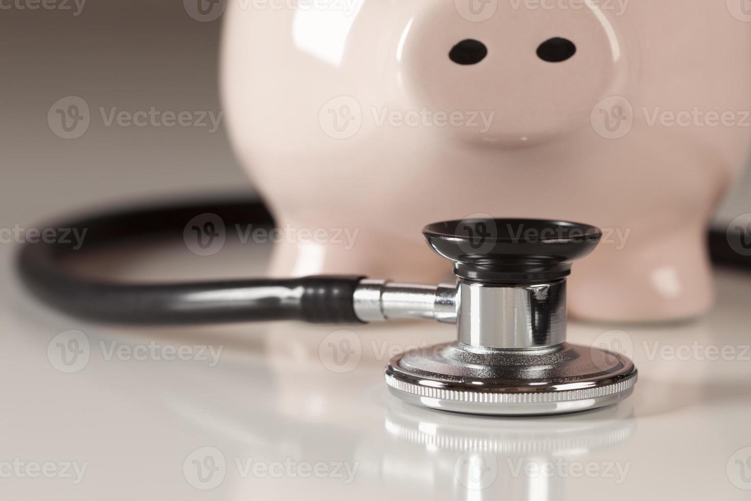 Piggy Bank and Stethoscope with Selective Focus photo