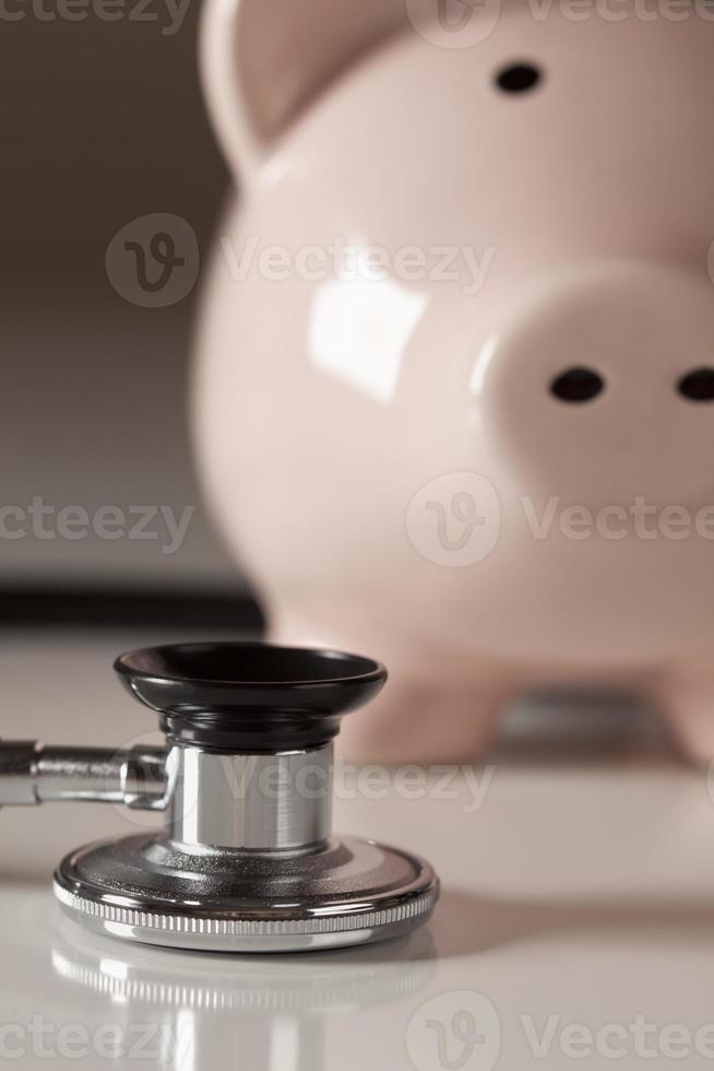 Piggy Bank and Stethoscope with Selective Focus photo