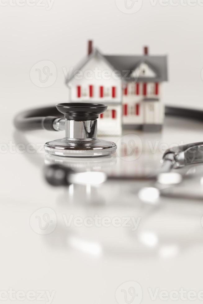 Stethoscope with Small Model Home photo