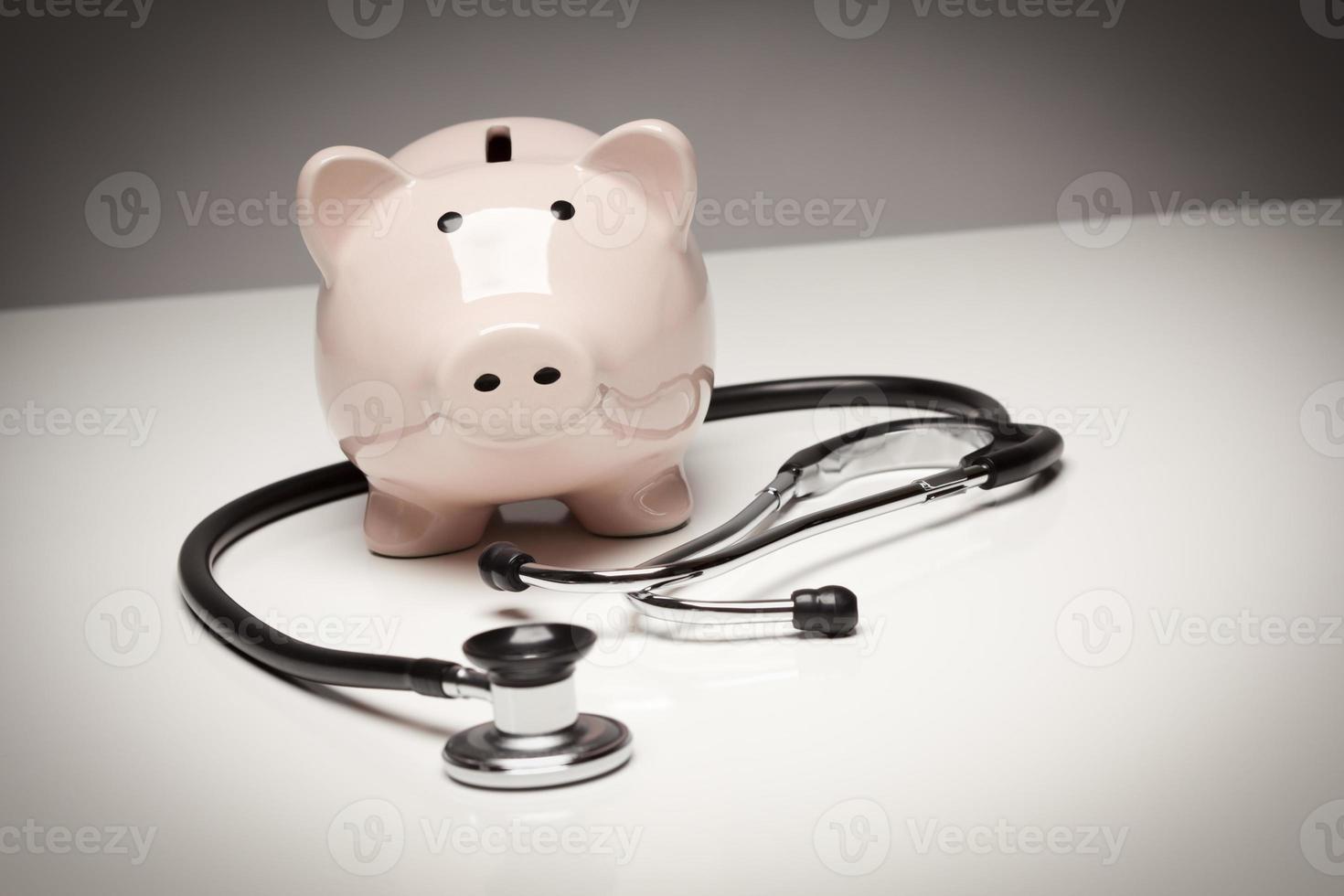 Piggy Bank and Stethoscope with Selective Focus photo