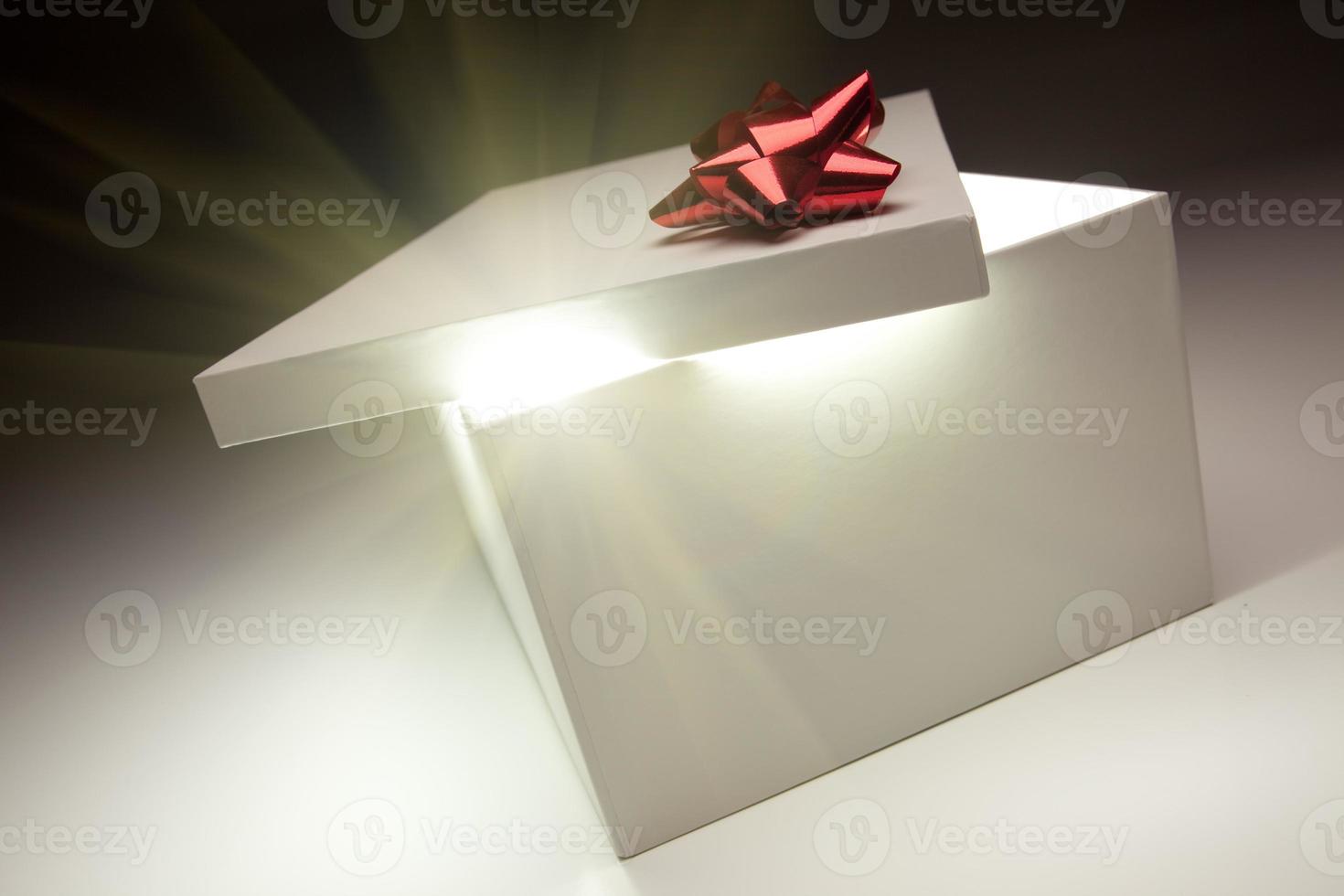 Red Bow Gift Box Lid Showing Very Bright Contents photo