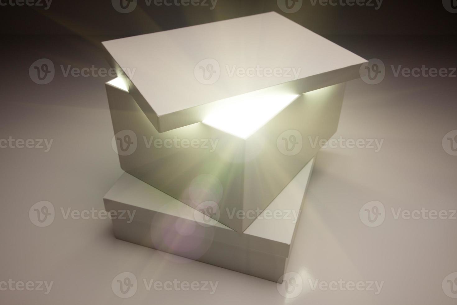 White Box with Lid Revealing Something Very Bright photo