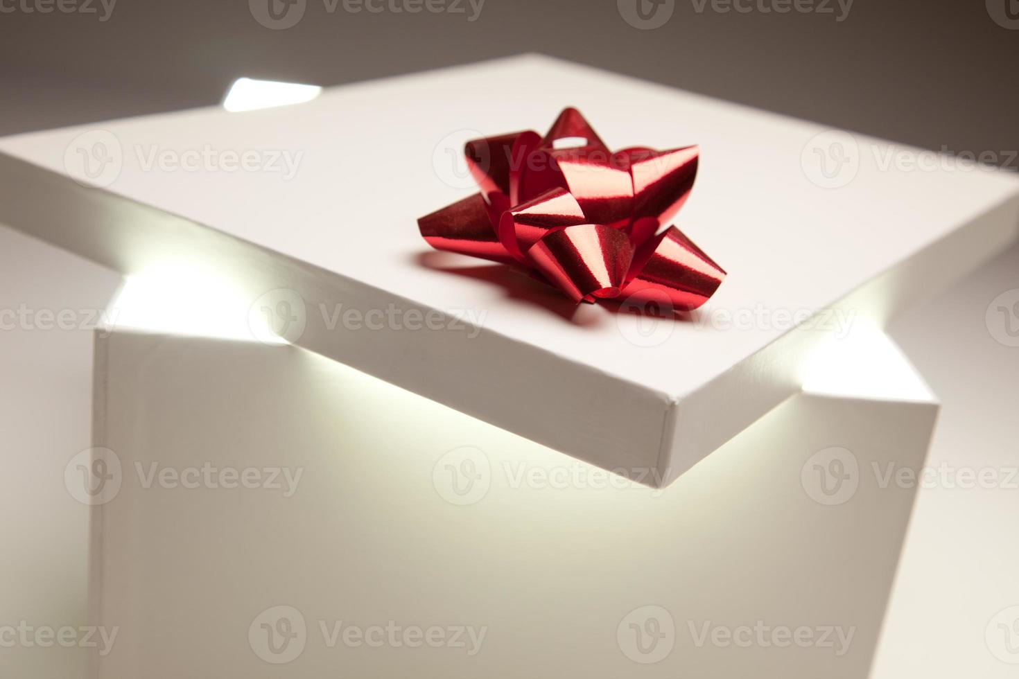 Red Bow Gift Box Lid Showing Very Bright Contents photo