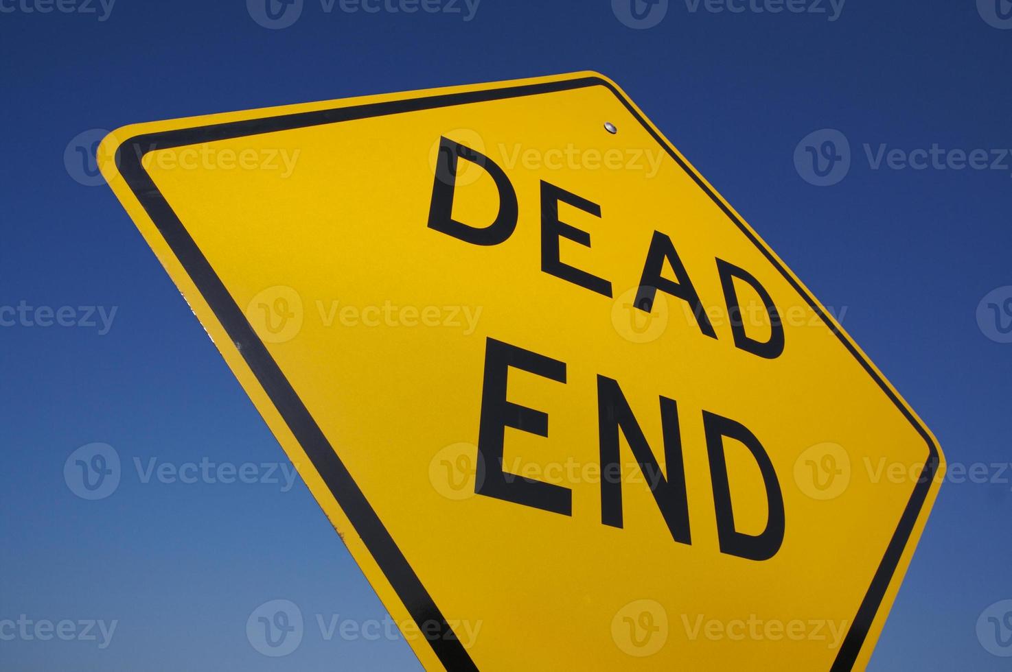 Dead End Traffic Sign Against Blue photo