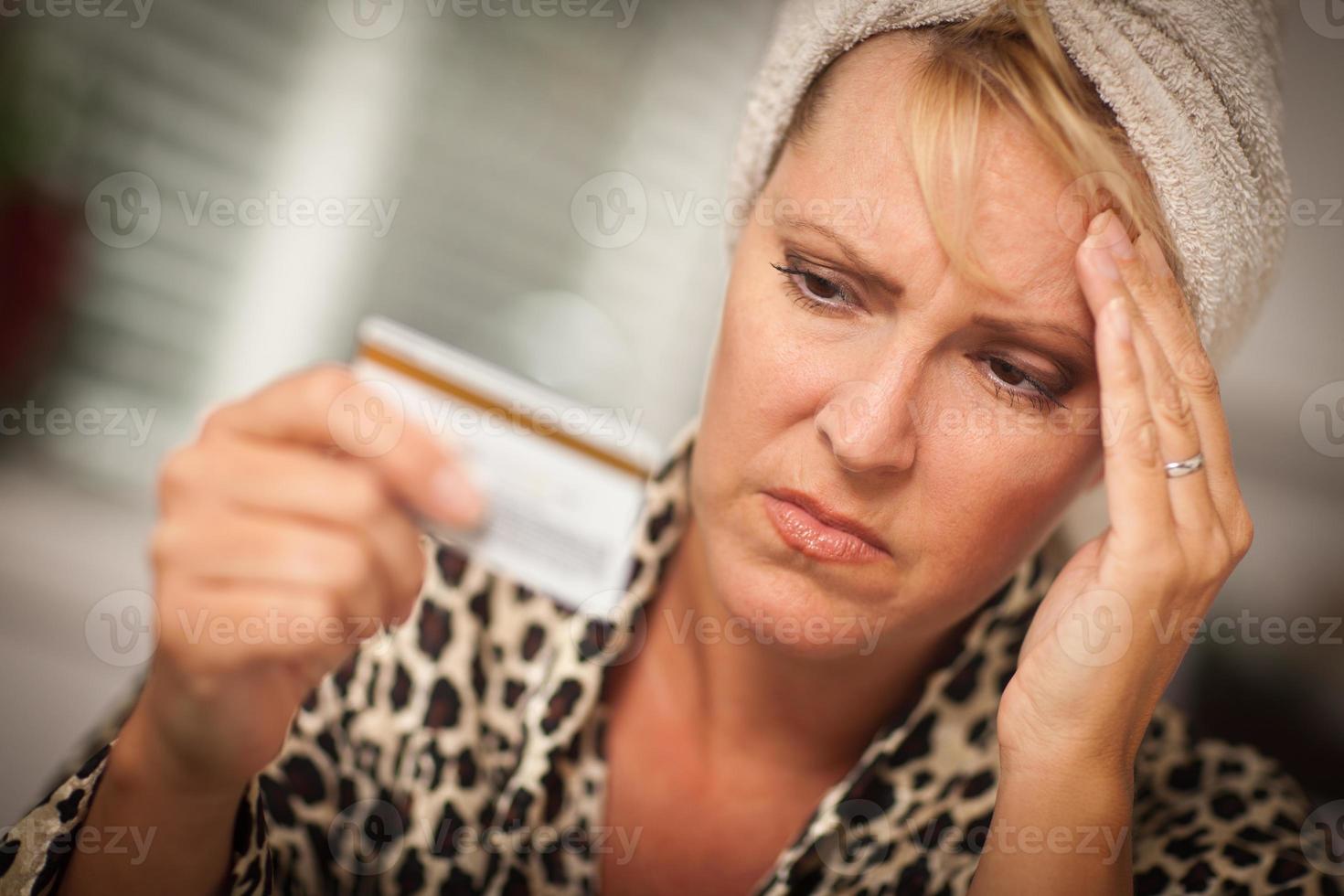 Upset Woman Holding Her Credit Card photo