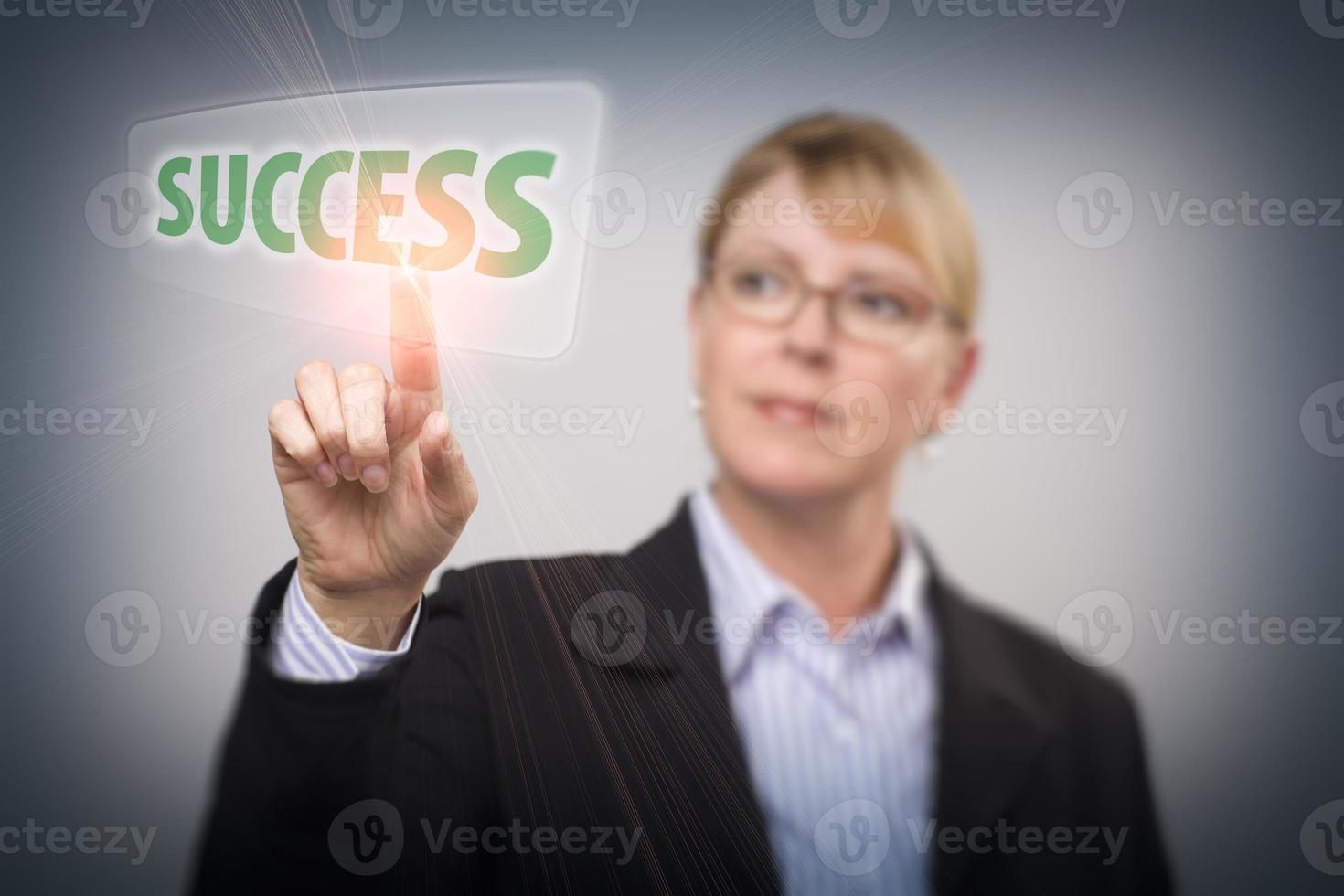 Woman Pushing Success Button on Interactive Touch Screen photo
